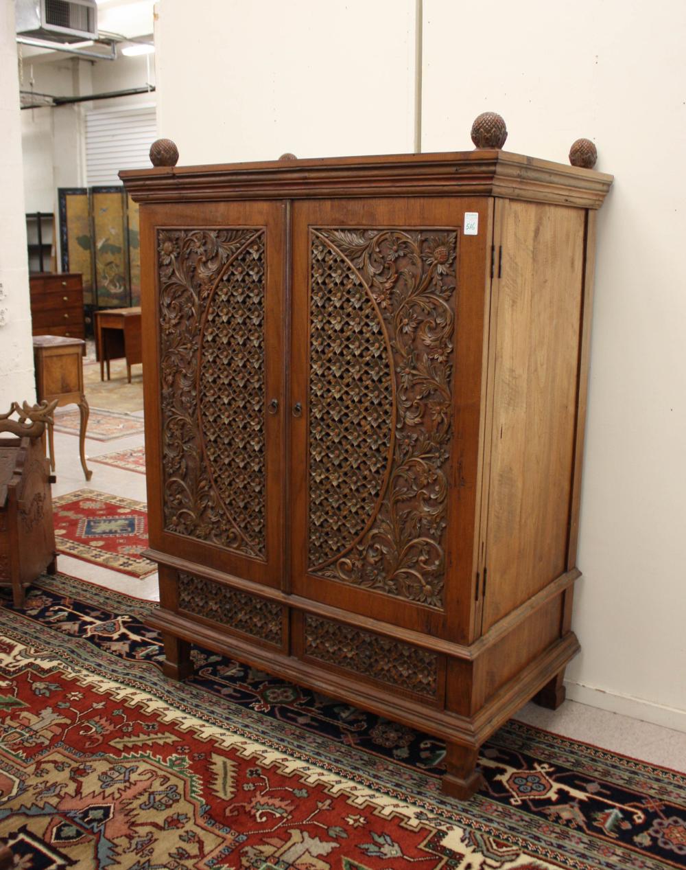 Appraisal: EAST INDIES COLONIAL STYLE CABINET a double-door cabinet of carved