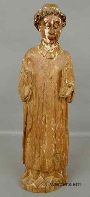 Appraisal: Large carved pine figure of a monk holding a book