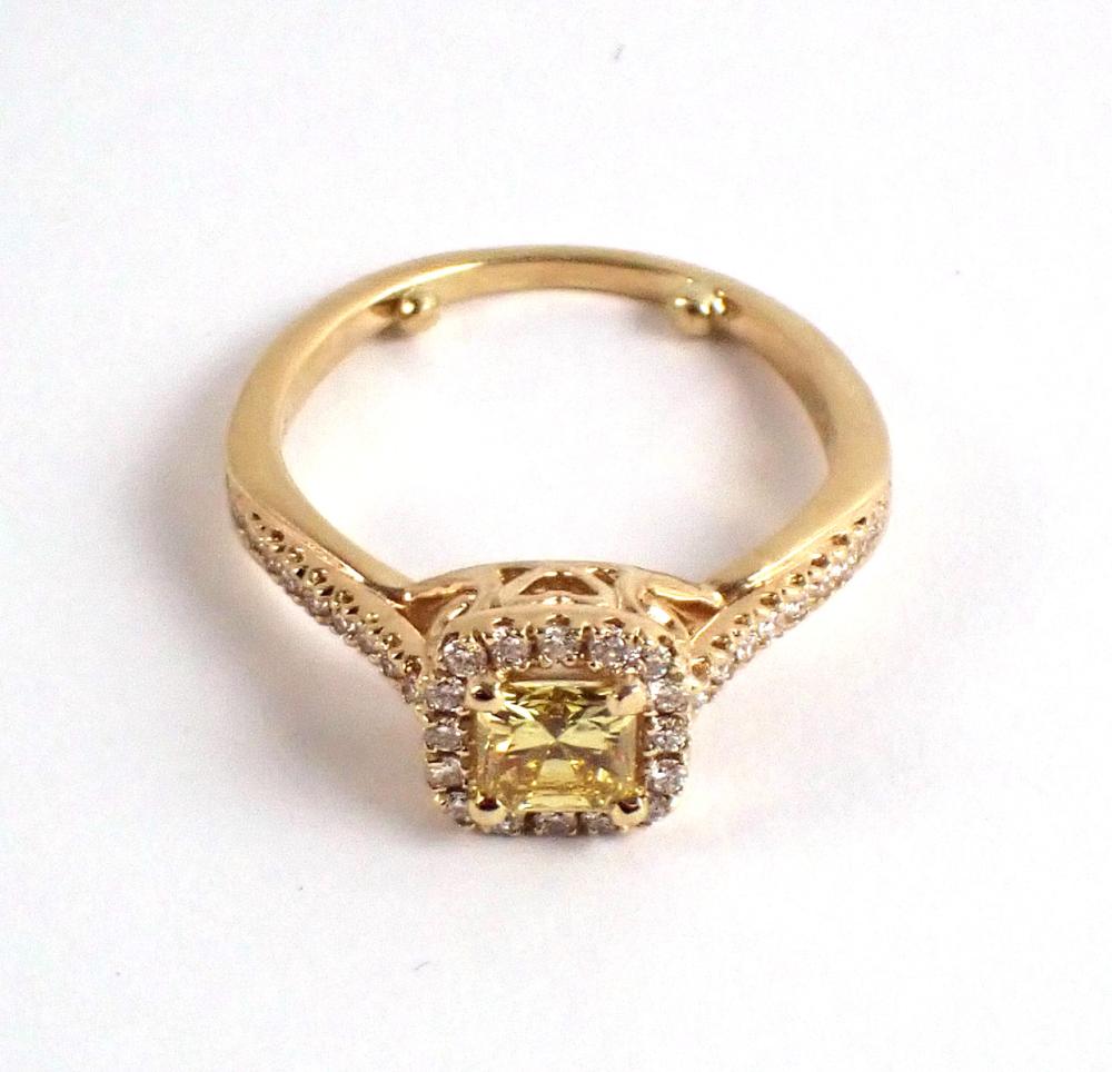 Appraisal: FANCY YELLOW DIAMOND AND FOURTEEN KARAT GOLD RING with round-cut