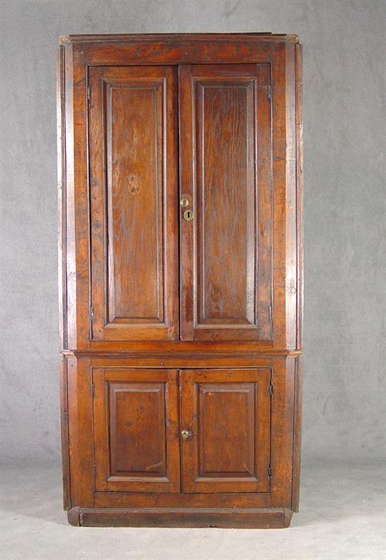 Appraisal: English Oak Corner Cupboard Circa One piece construction with barrel