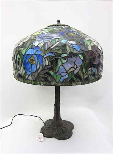 Appraisal: A STAINED AND LEADED GLASS TABLE LAMP on patinated bronzed