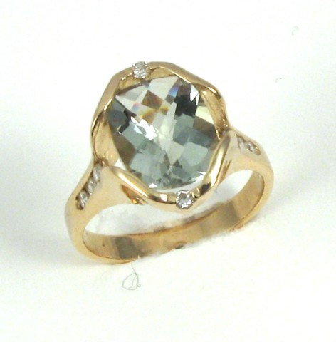 Appraisal: HELIODOR AND FOURTEEN KARAT GOLD RING centering an oval checkerboard-cut