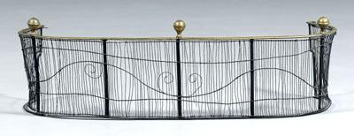 Appraisal: Wirework fender scrolled wirework below brass finials curved ends with