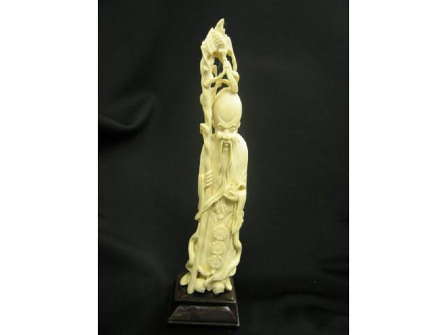 Appraisal: Carved Ivory Figurine of an Immortal tall plus wooden base