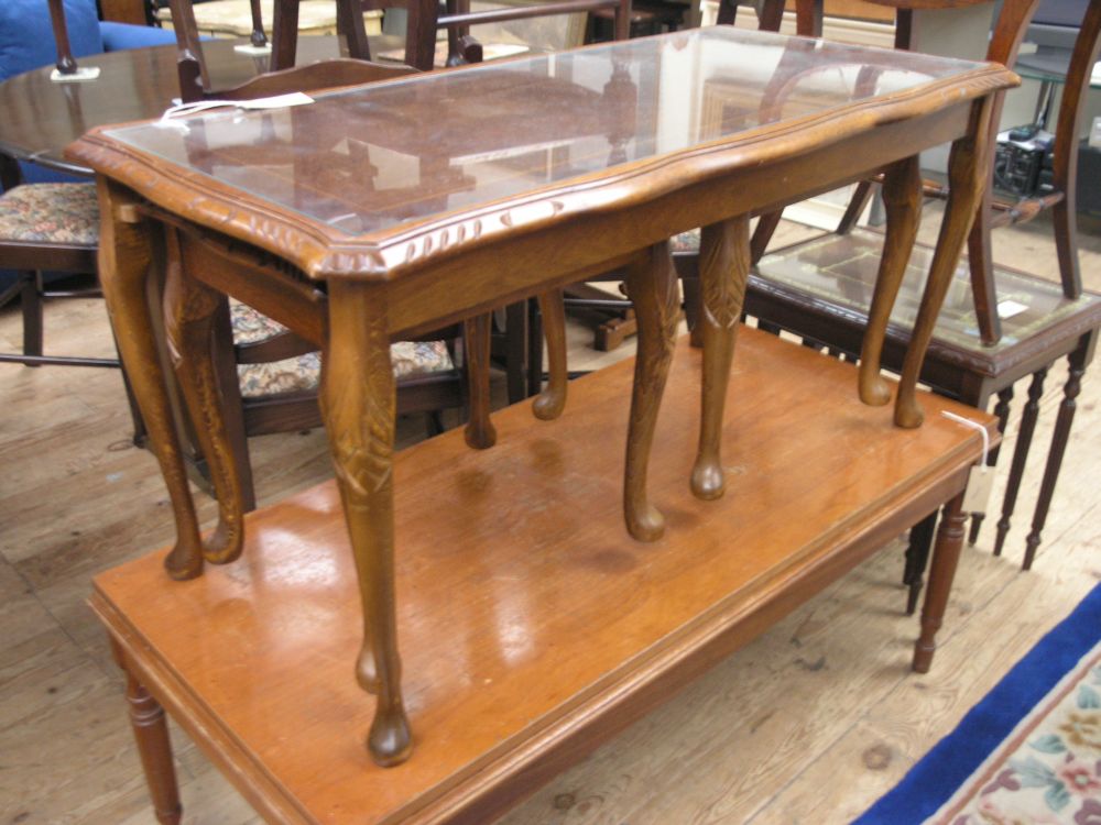 Appraisal: A reproduction mahogany nest of three tables with plate glass