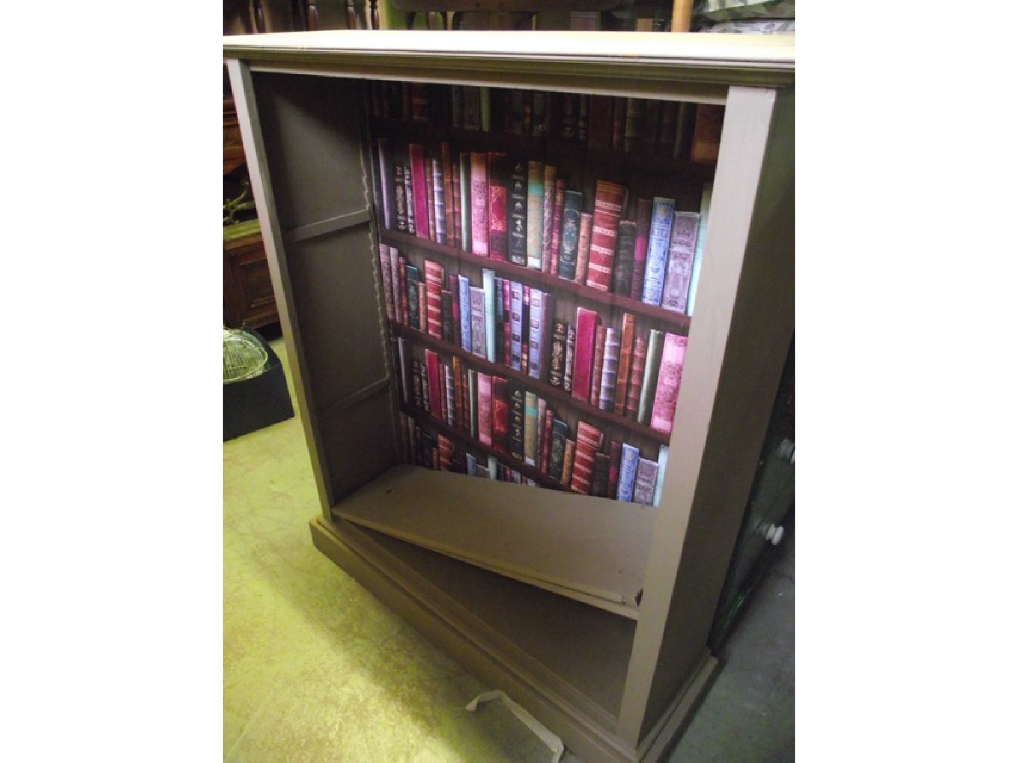 Appraisal: A freestanding open bookcase with later grey painted finish and