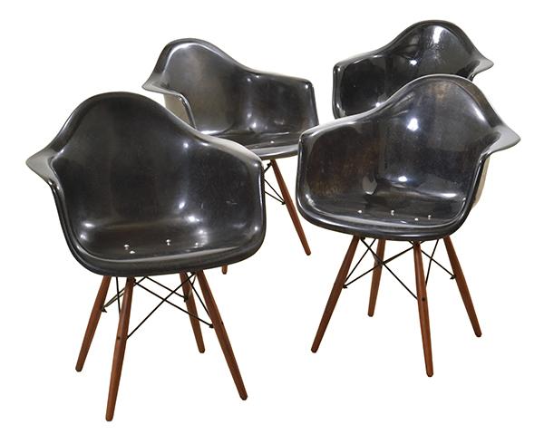 Appraisal: FOUR ARM SHELL DINING CHAIRS black fibreglass wood and wire