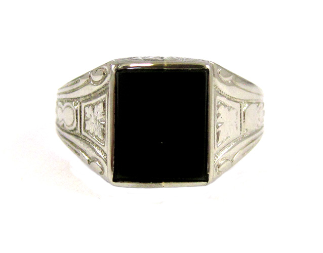 Appraisal: BLACK ONYX AND TEN KARAT WHITE GOLD RING set with