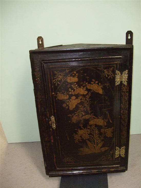 Appraisal: th century oak and black lacquered wall hanging corner cupboard