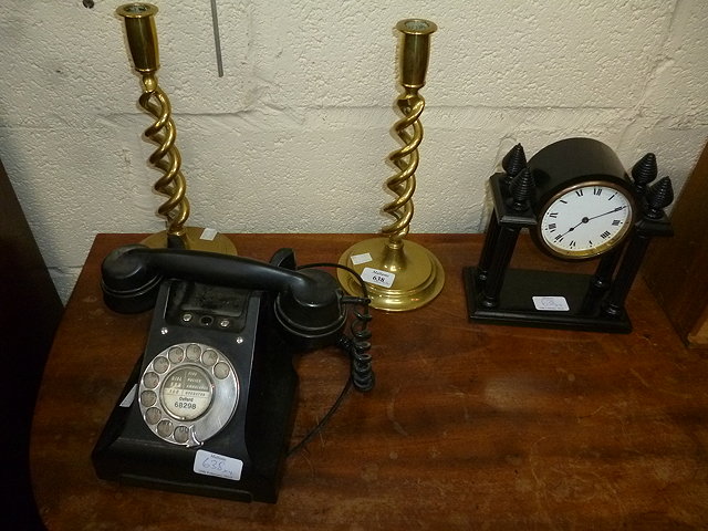 Appraisal: AN EBONISED MANTEL TIMEPIECE together with a pair of brass