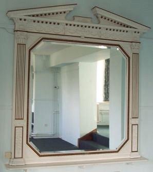 Appraisal: A late th Century overmantel mirror with broken arch pediment