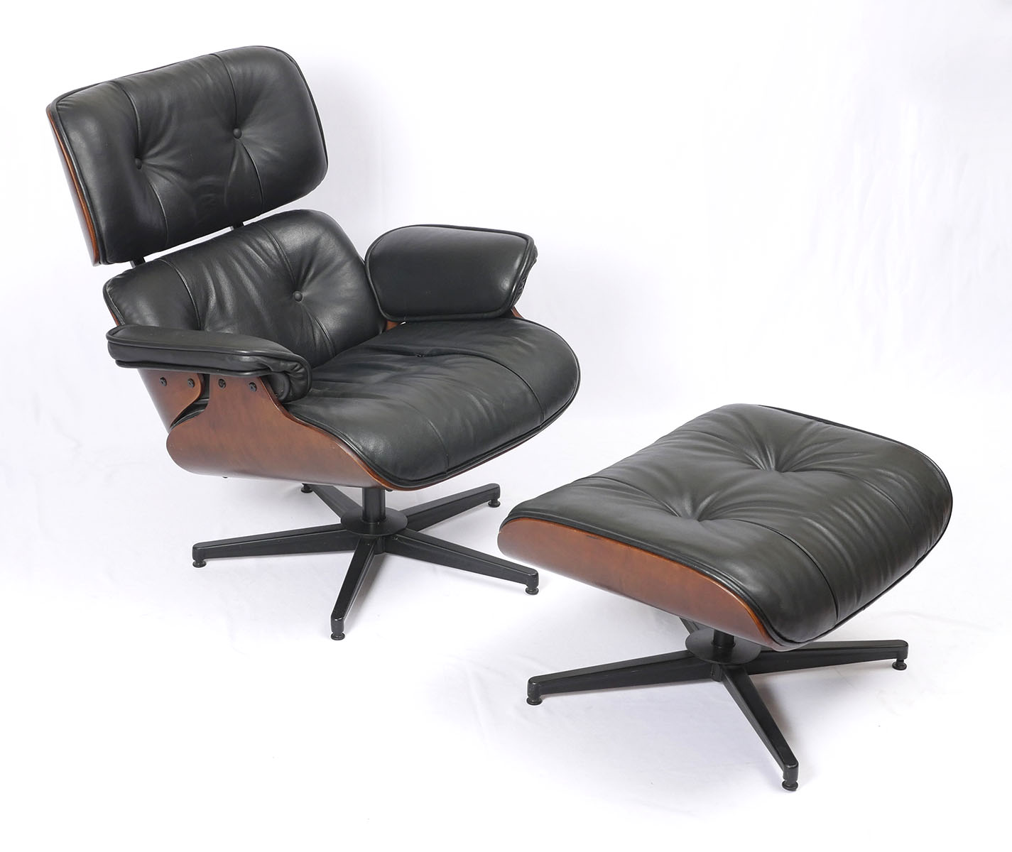 Appraisal: EAMES STYLE CHAIR AND OTTOMAN Eames style swiveling chair and