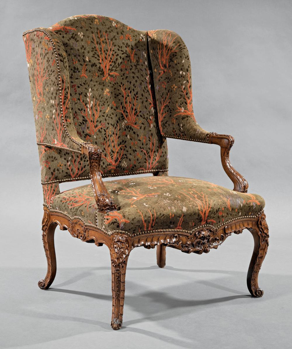 Appraisal: R gence-Style Carved Fruitwood Fauteuil Oreilles th c arched back