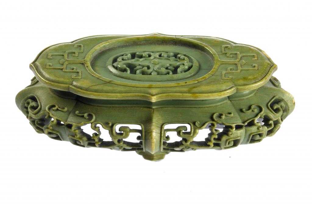 Appraisal: A CHINESE GREEN STAINED IVORY STAND the top with pierced