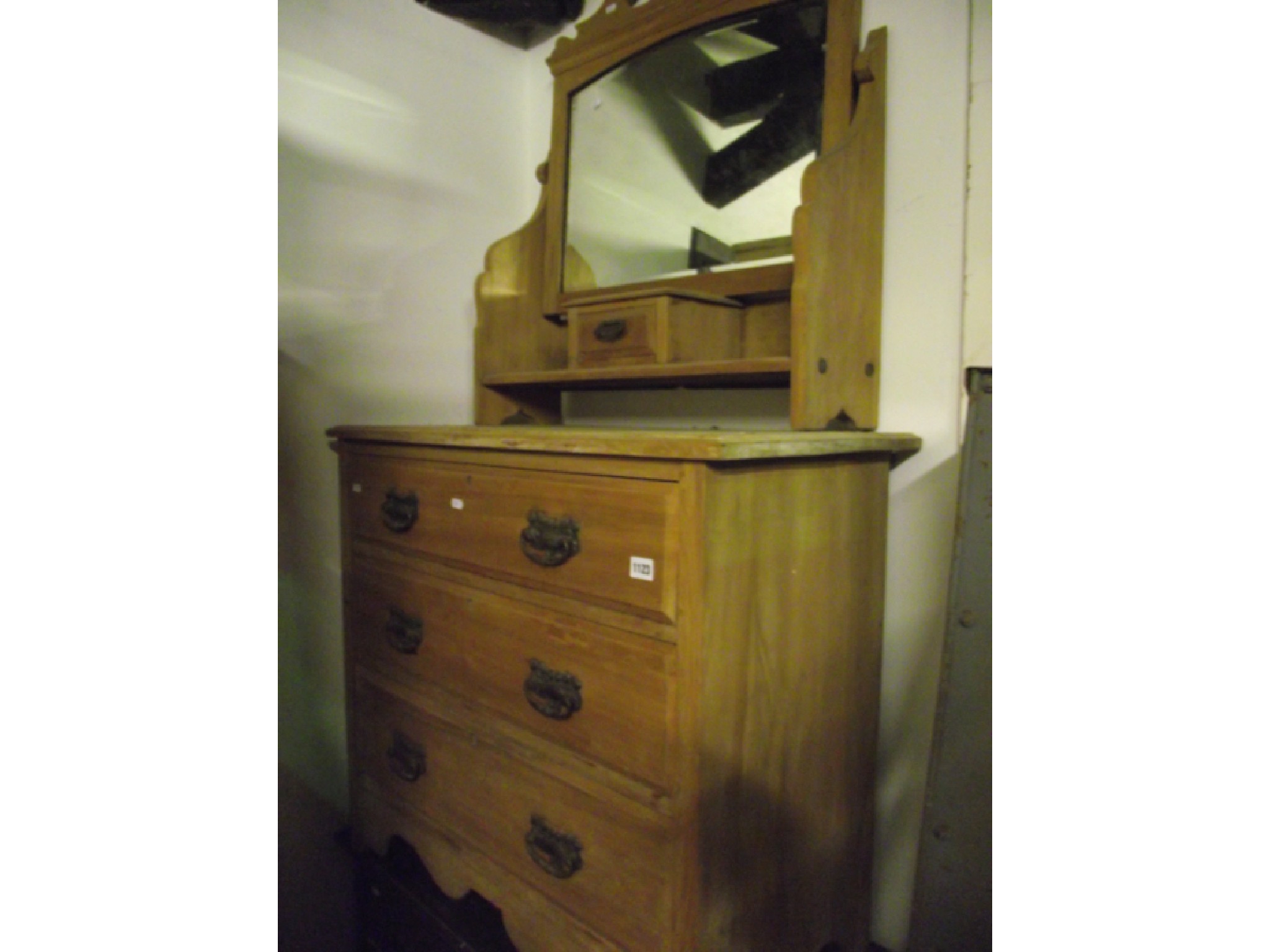 Appraisal: An Edwardian stripped walnut dressing chest of three long drawers