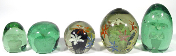 Appraisal: Three Victorian green glass dump weights with floral centres together