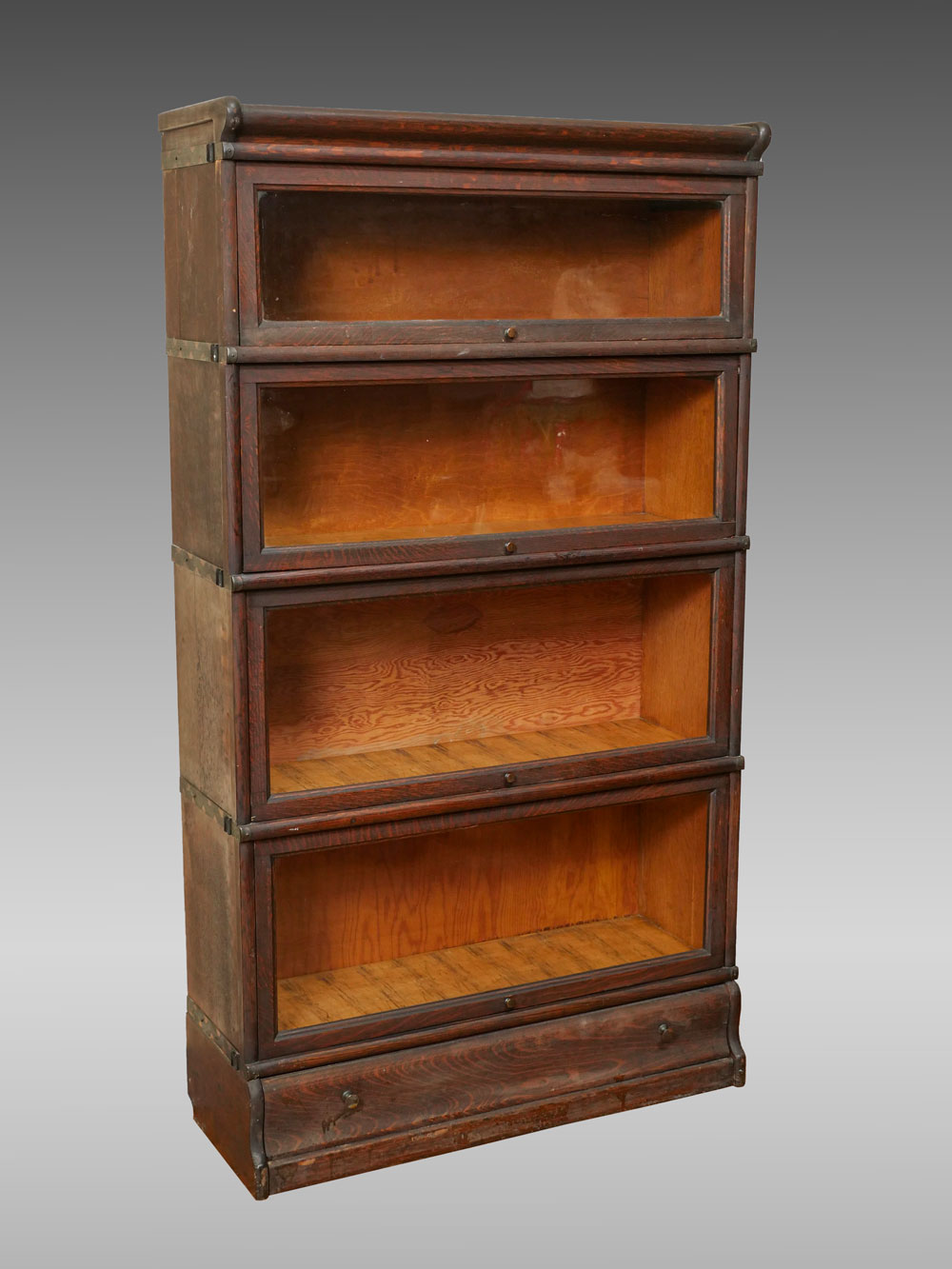 Appraisal: DIMINUTIVE BARRISTER STACKING BOOKCASE Oak Barrister bookcase having graduated glass