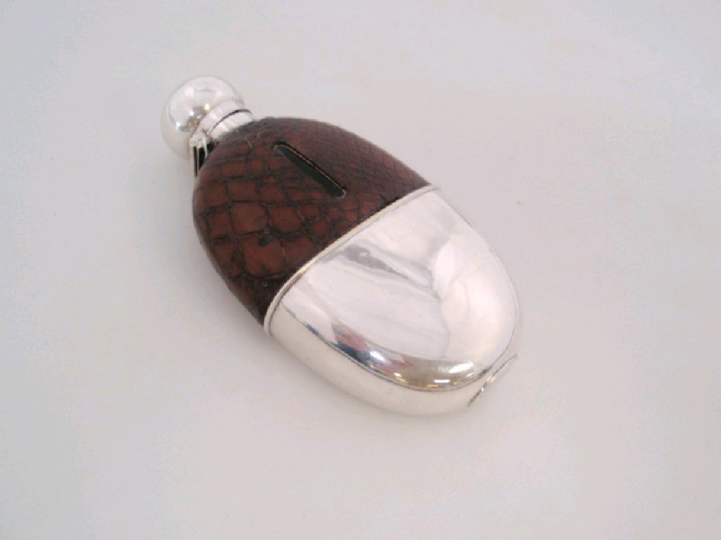 Appraisal: A Drew Sons silver plated hip flask with crocodile cover