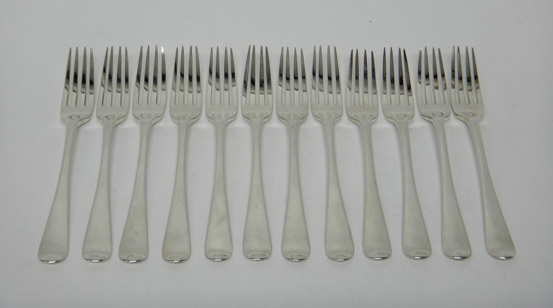 Appraisal: Twelve silver Old English table forks London combined weight gms