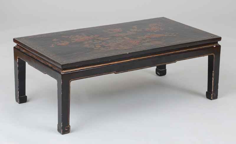 Appraisal: CHINESE BLACK LACQUER AND PARCEL-GILT LOW TABLE The top decorated