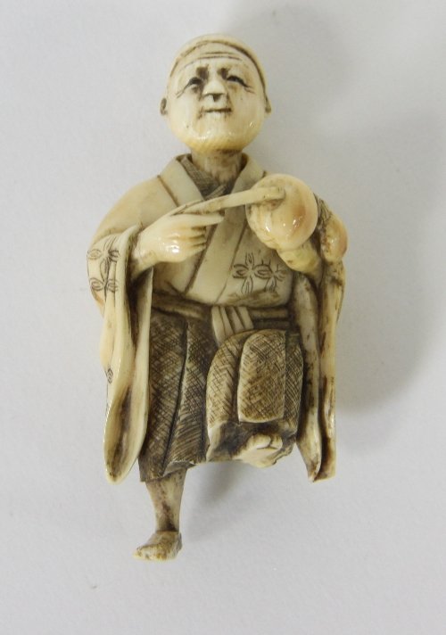 Appraisal: A Japanese carved ivory netsuke Meiji period depicting a musician