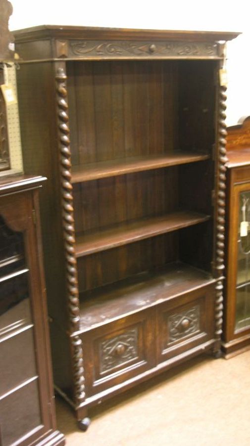 Appraisal: A late Victorian solid dark oak bookcase two adjustable shelves