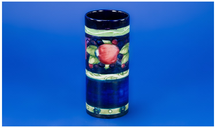 Appraisal: William Moorcroft Cylindrical Shaped Vase Pomegranate and Berries Design Marks