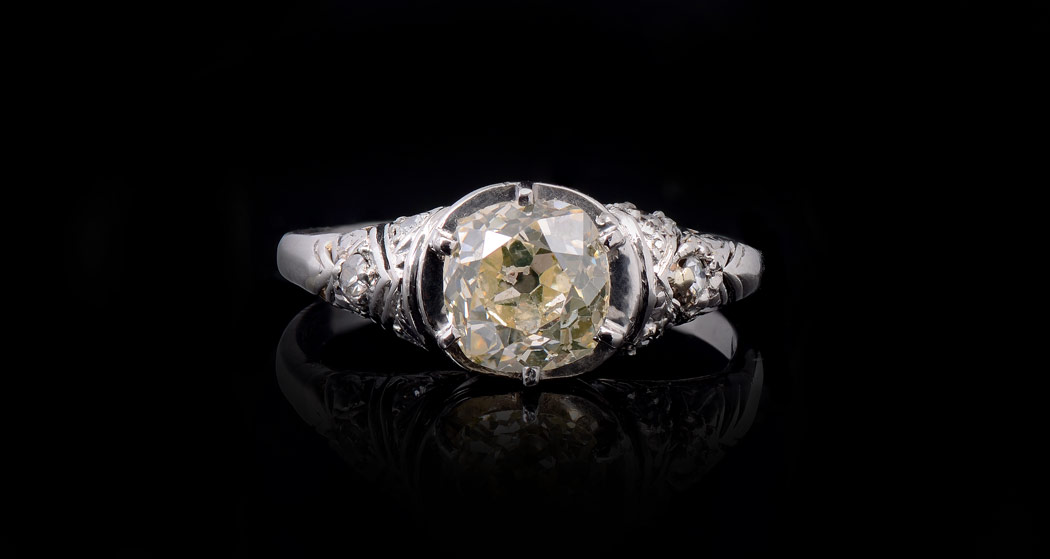 Appraisal: PLATINUM FANCY COLOR DIAMOND RING Featuring an old mine cushion