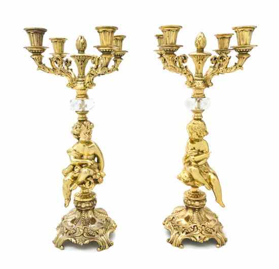 Appraisal: A Pair of Louis XV Style Brass Four-Light Candelabra th