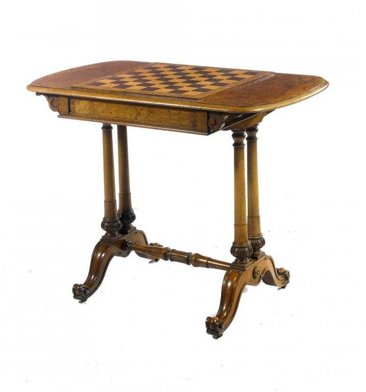 Appraisal: A VICTORIAN WALNUT GAMES TABLE the bow ended top in