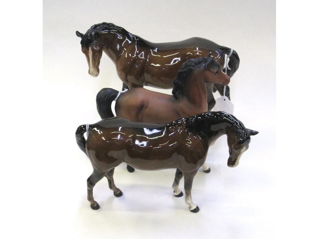 Appraisal: Three Beswick figures of brown horses slight def