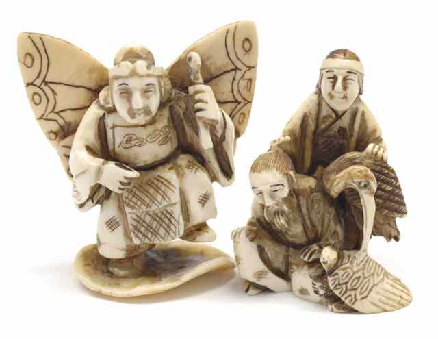 Appraisal: TWO CARVED IVORY NETSUKE two men with stork and turtle