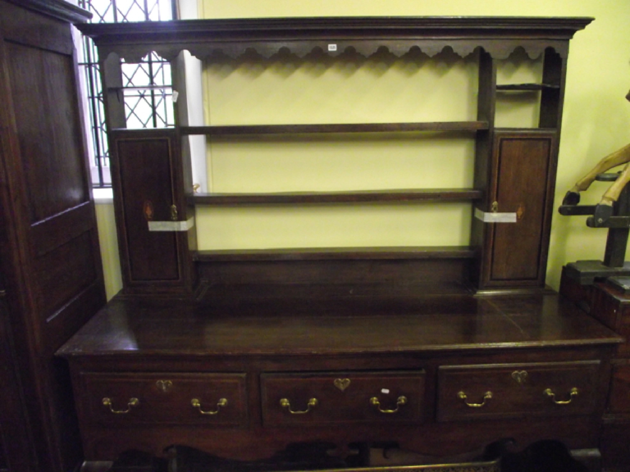 Appraisal: A Georgian style oak dresser the lower section enclosed by