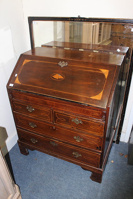 Appraisal: AN OLD MAHOGANY BUREAU with shell inlay to the sloping