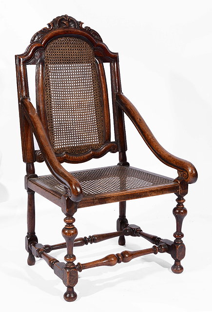 Appraisal: A TH CENTURY STYLE OAK ELBOW CHAIR with cane seat