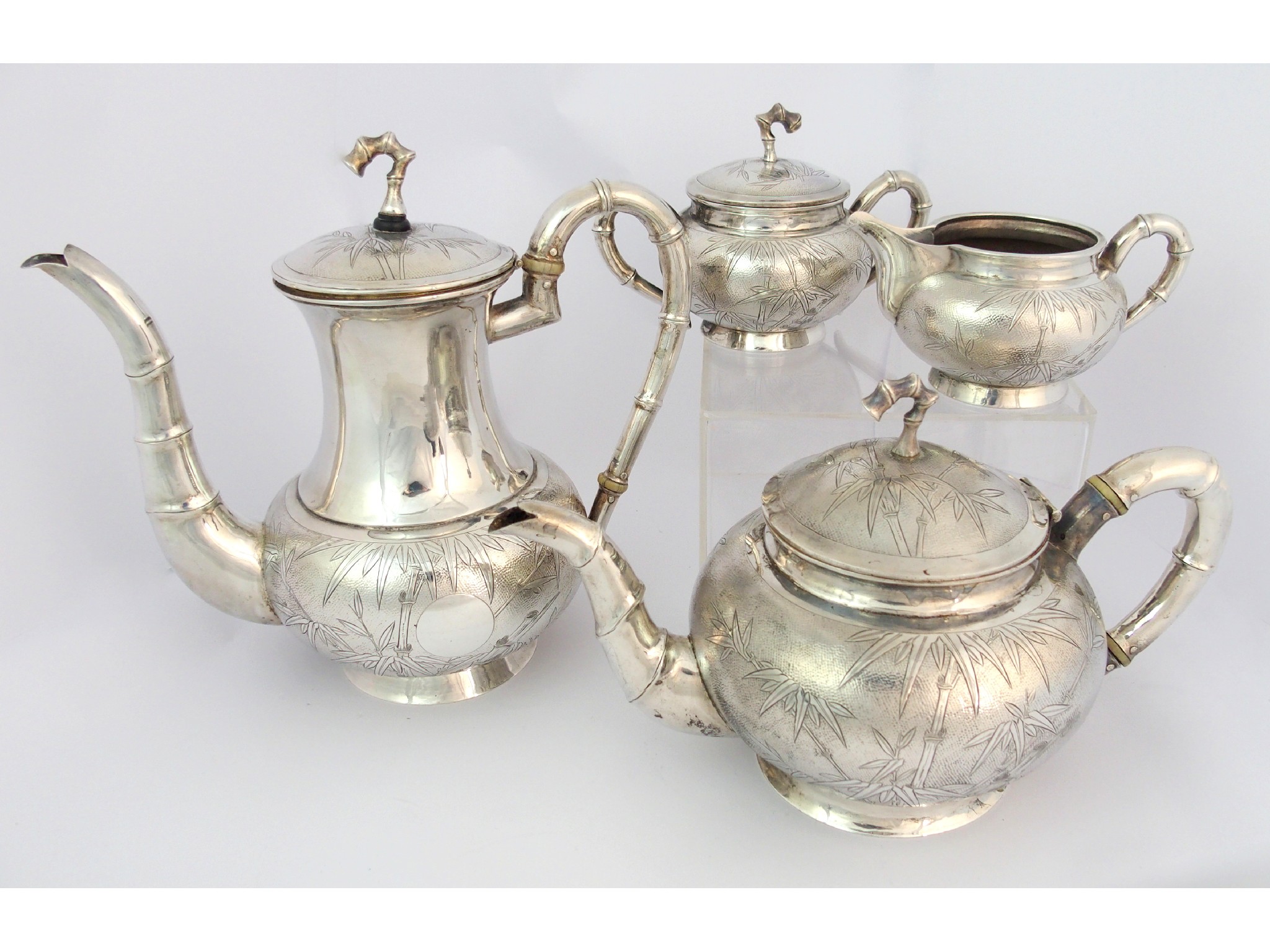 Appraisal: A Chinese sterling silver four-piece tea serviceby Wai Kee Hong