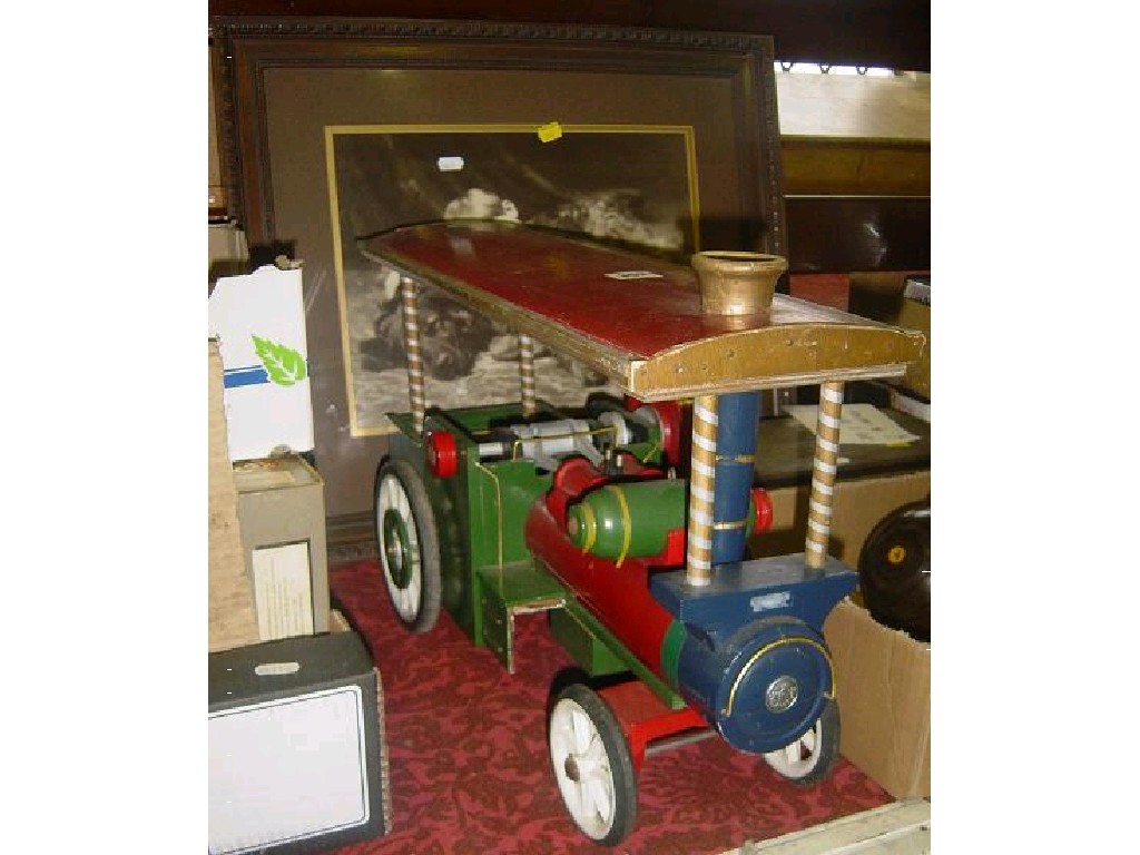 Appraisal: A model timber showmans engine with brightly painted finish together