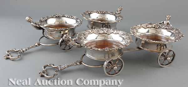 Appraisal: A Pair of English Silverplate Figural Wine Trolleys in the