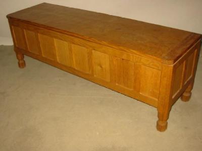 Appraisal: AN ADZED OAK BLANKET BOX by Robert Mouseman Thompson of