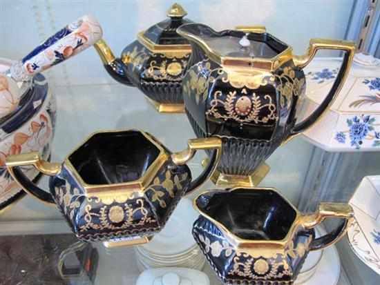 Appraisal: TH CENTURY CONTINENTAL BLACK GLAZED GILDED TEA SERVICE FOUR PIECES