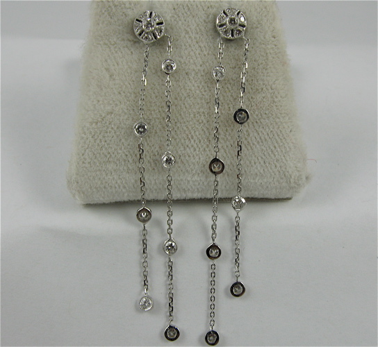 Appraisal: PAIR OF DIAMOND AND K WHITE GOLD EARRINGS each with