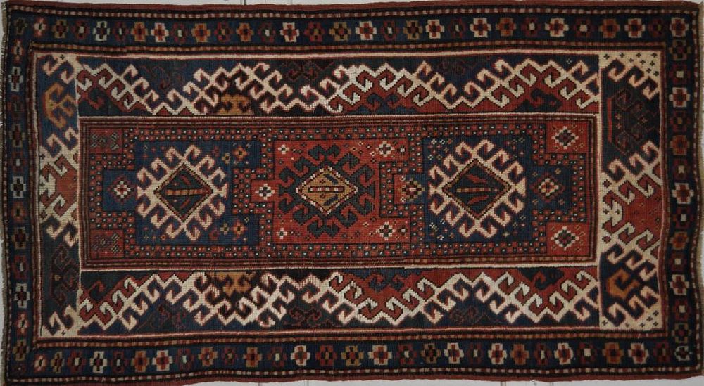 Appraisal: Caucasian Kazak Rug ' by ' Light wear to fringe