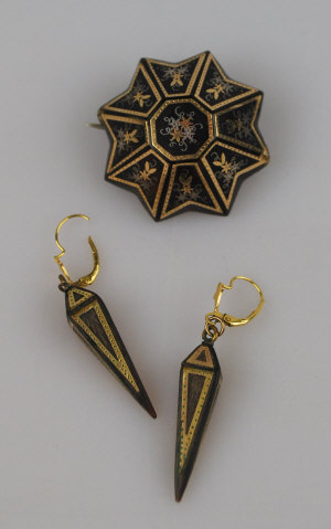 Appraisal: Victorian tortoiseshell pique star-shaped brooch having silver and gold insets