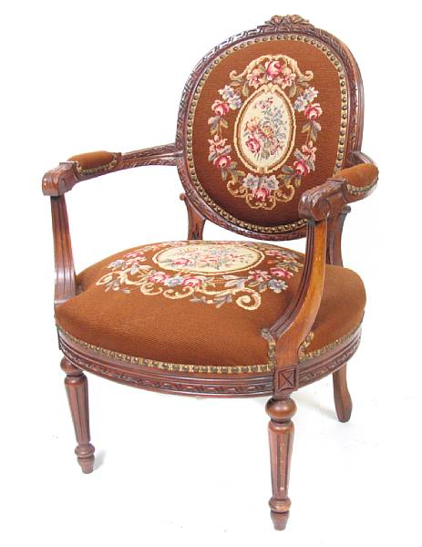 Appraisal: A Louis XVI style carved walnut fauteuil early th century