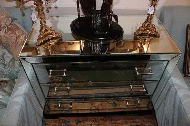 Appraisal: AN ART DECO STYLE MIRRORED CHEST of three long drawers