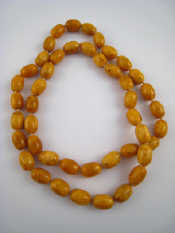 Appraisal: An amber necklace approx cm long beads approx x mm