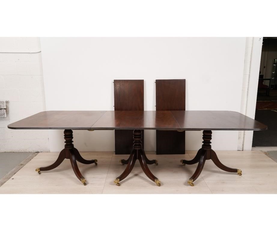 Appraisal: Kittinger Williamsburg Reproduction mahogany three-pedestal base banquet table with brass