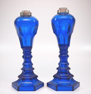 Appraisal: Pressed Arch Font oil fluid lamps pair Two mid th