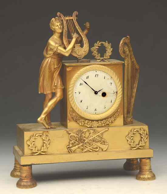 Appraisal: A TH CENTURY FRENCH GILT METAL TIMEPIECE with white enamel