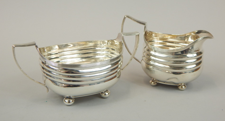 Appraisal: A George V silver two handled sugar bowl with reeded